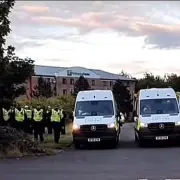 Protesters Gather Outside Asylum Seeker Hotel in Greenock Amid Police Presence