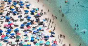 Sardinia Beach Bans Umbrellas for Ages 18-64 to Protect Environment
