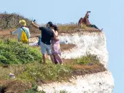 Tourists Risk Lives on Crumbling Cliffs at Birling Gap During Heatwave