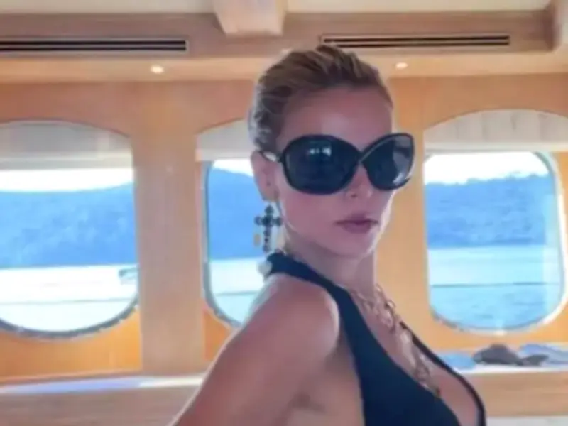 Brooks Nader Risks Wardrobe Malfunction in Plunging Top on Yacht