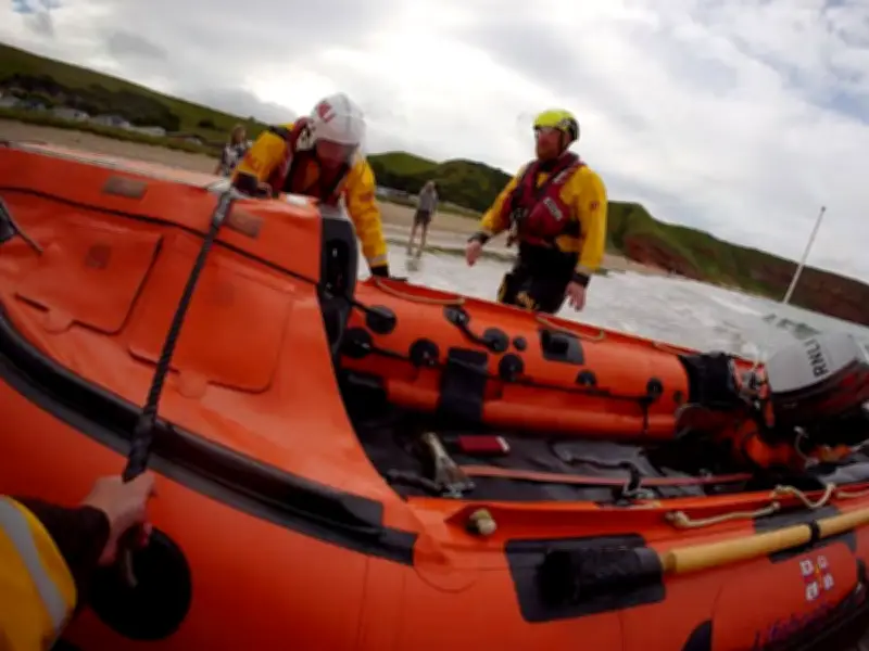 Father and Son RNLI Volunteers Rescue Stranded Paddleboarder and Fisherman