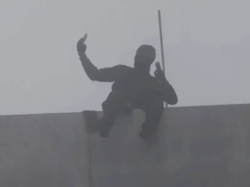 Masked Man Scales 460ft Bolte Bridge, Demands Taxes Cut and Sandwich