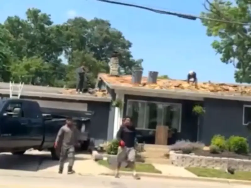 Roofers Fall Off Roof Mid-Fight, Continue Brawl on Ground in Viral Video