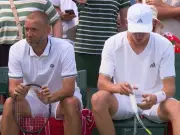 Wimbledon Match Halted by Fire Alarm: Evans and Searle Wait for Security